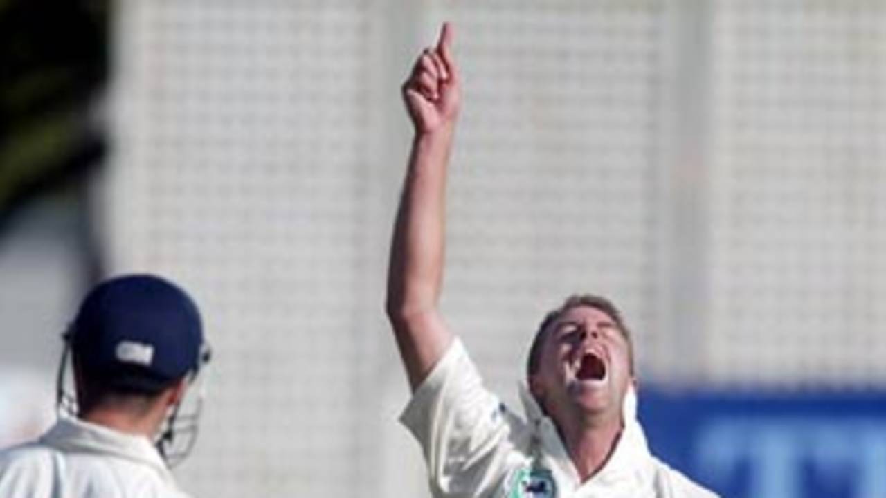 New Zealand bowler Chris Drum celebrates the dismissal of England batsman Michael Vaughan, caught by Stephen Fleming for seven. 2nd Test: New Zealand v England at Basin Reserve, Wellington, 21-25 March 2002 (22 March 2002).