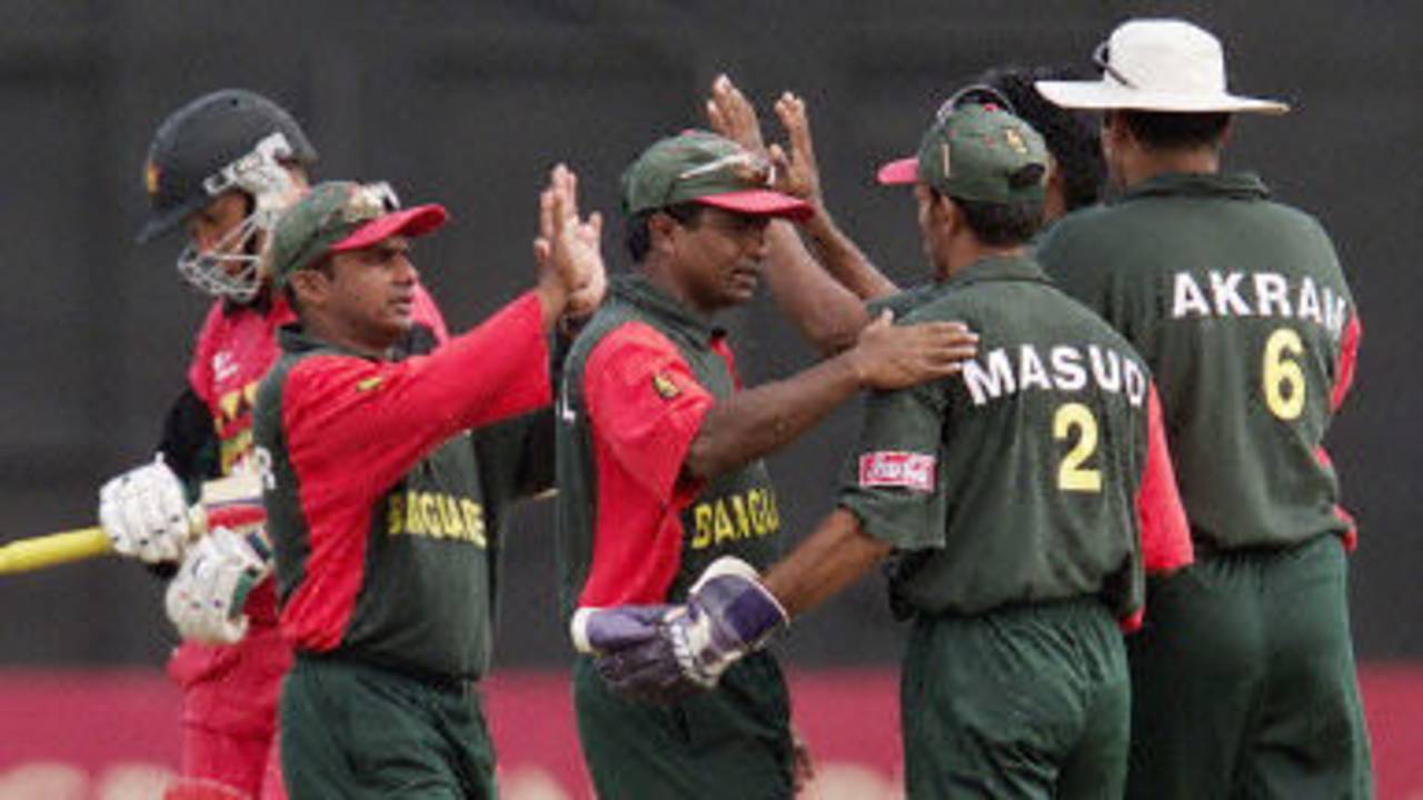 Rahman, Islam, Masud and Khan celebrate the wicket of Carlisle