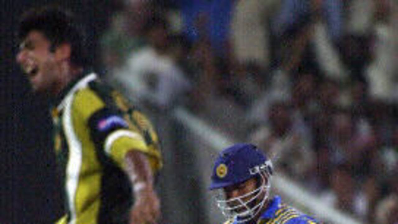 New fast bowler Kashif Raza celebrates his first ODI wicket after bowling Kaluwitharana