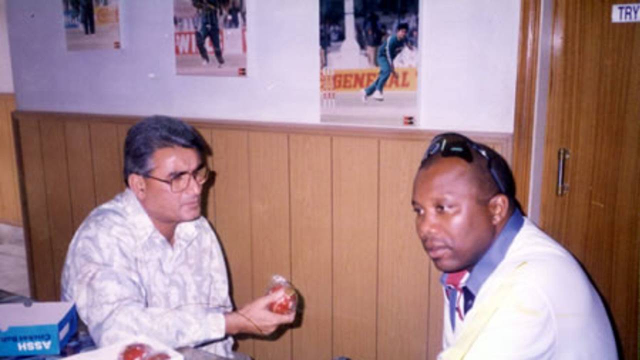 Malcolm Marshall and Azhar Zaidi discussing cricket balls at Zaidi Sports - during the West Indies tour to Pakistan, 1997-98