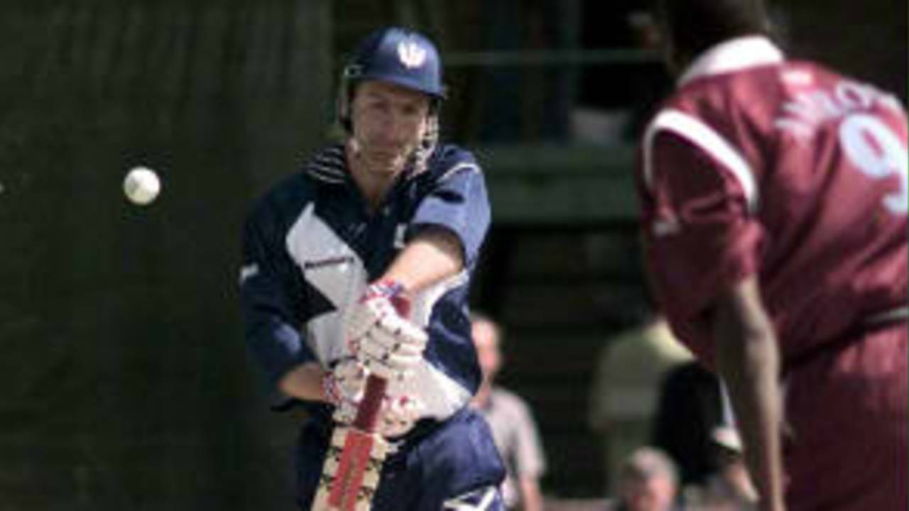 Scotland's Mike Smith evades the first bouncer from Curtly Ambrose during WC99