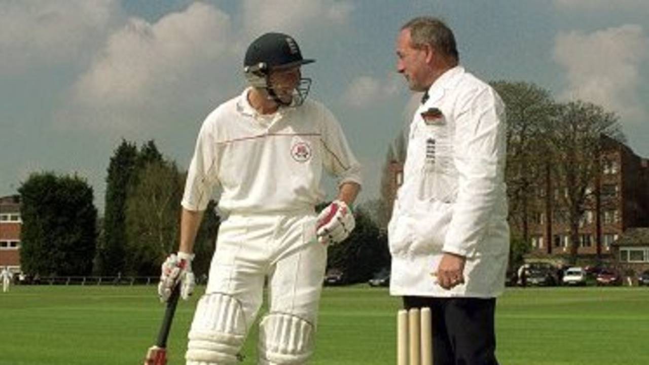 7 Apr 2000: Michael Atherton of Lancashire talks to umpire Alan Whitehead during the three day match against Cambridge University at Fenner's in Cambridge, England. Lancashire won the match by 170 runs.