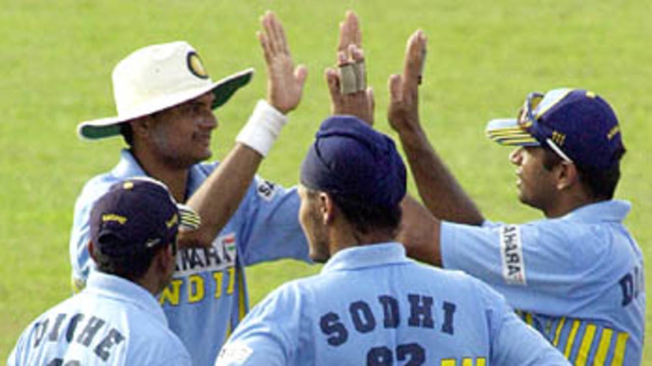 The Indians get together in celebration, as yet another Lankan wicket has fallen