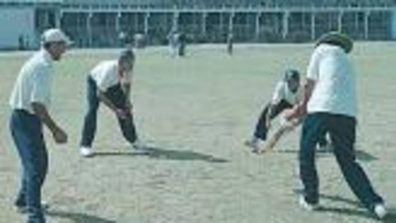 Rakesh Patel giving catch practice to Sodhi, Doru and Gambhir, (National Cricket Academy XI team), Zimbabwe in India, Nehru Stadium Indore, 07 November 2000