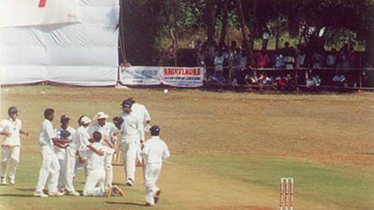 Shahbuddin being congratulated by team members after Ganesh got out, Ranji Trophy South Zone League, 2000/01, Karnataka v Andhra, Union Gymkhana Ground, Belgaum, 15-18 November 2000 (Day 2).
