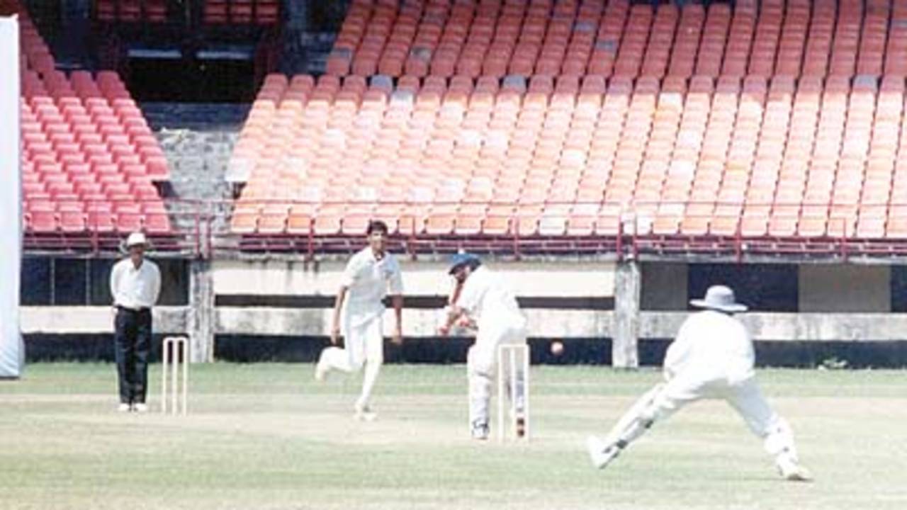 Dinesh Rao tries to flick the ball from Chandran