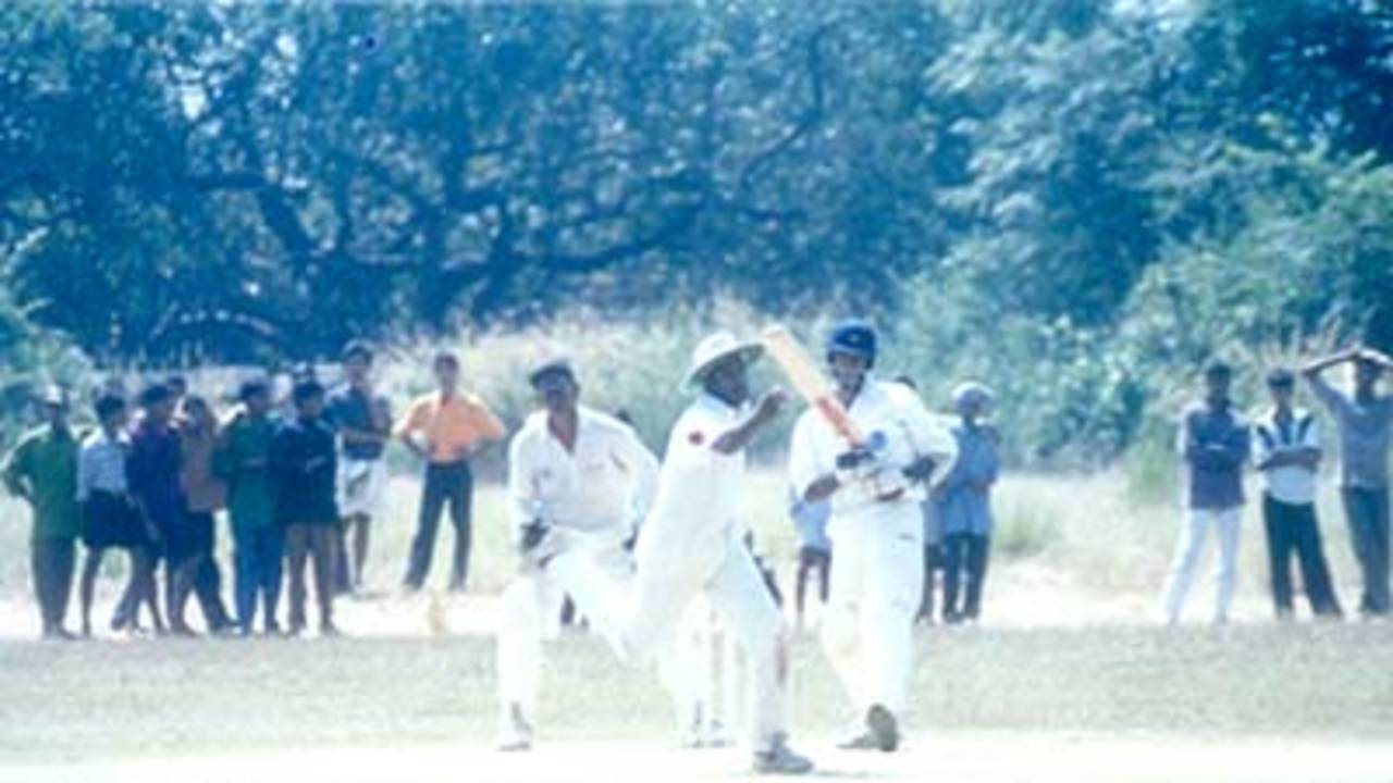 MP Sorab gets one past a lunging Daniel Manohar at silly point, Kerala v Hyderabad, Ranji Trophy (South Zone League) 1999/00, 24-27 November 1999 at Regional Engineering College Ground, Kozhikode