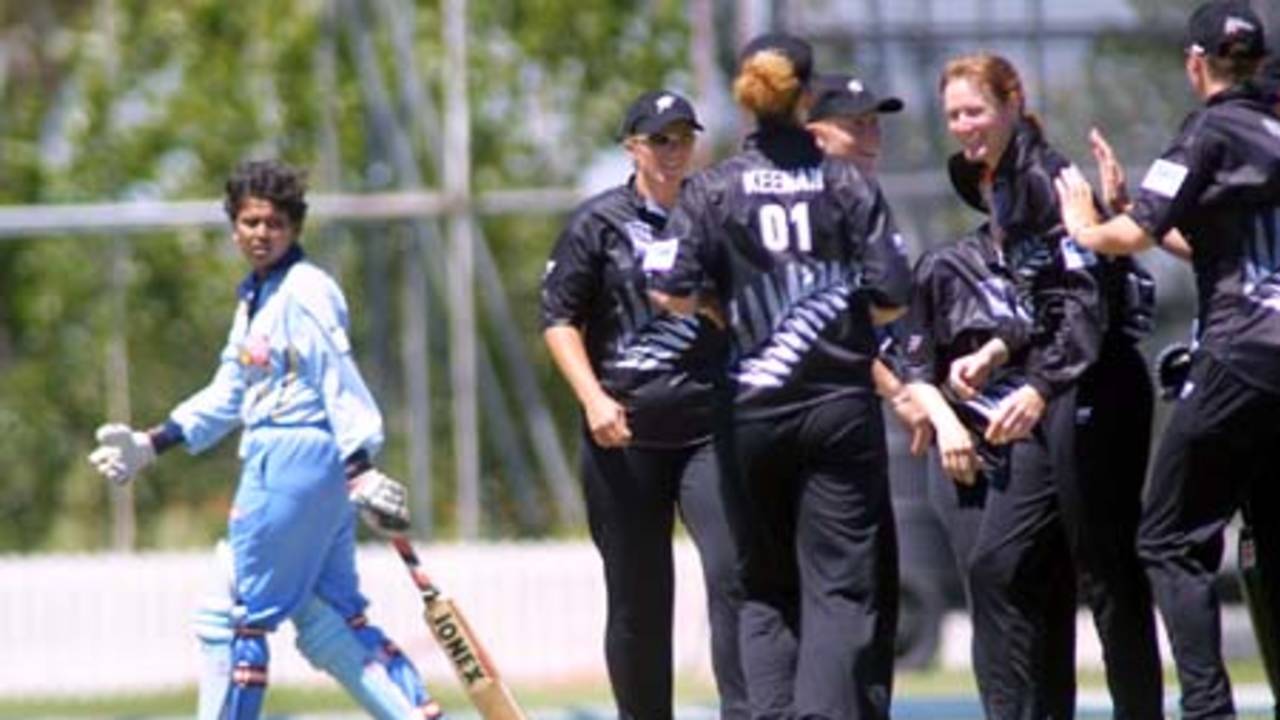 Rupanjali Shastri looks confused as she watches New Zealand celebrate her wicket (lbw)