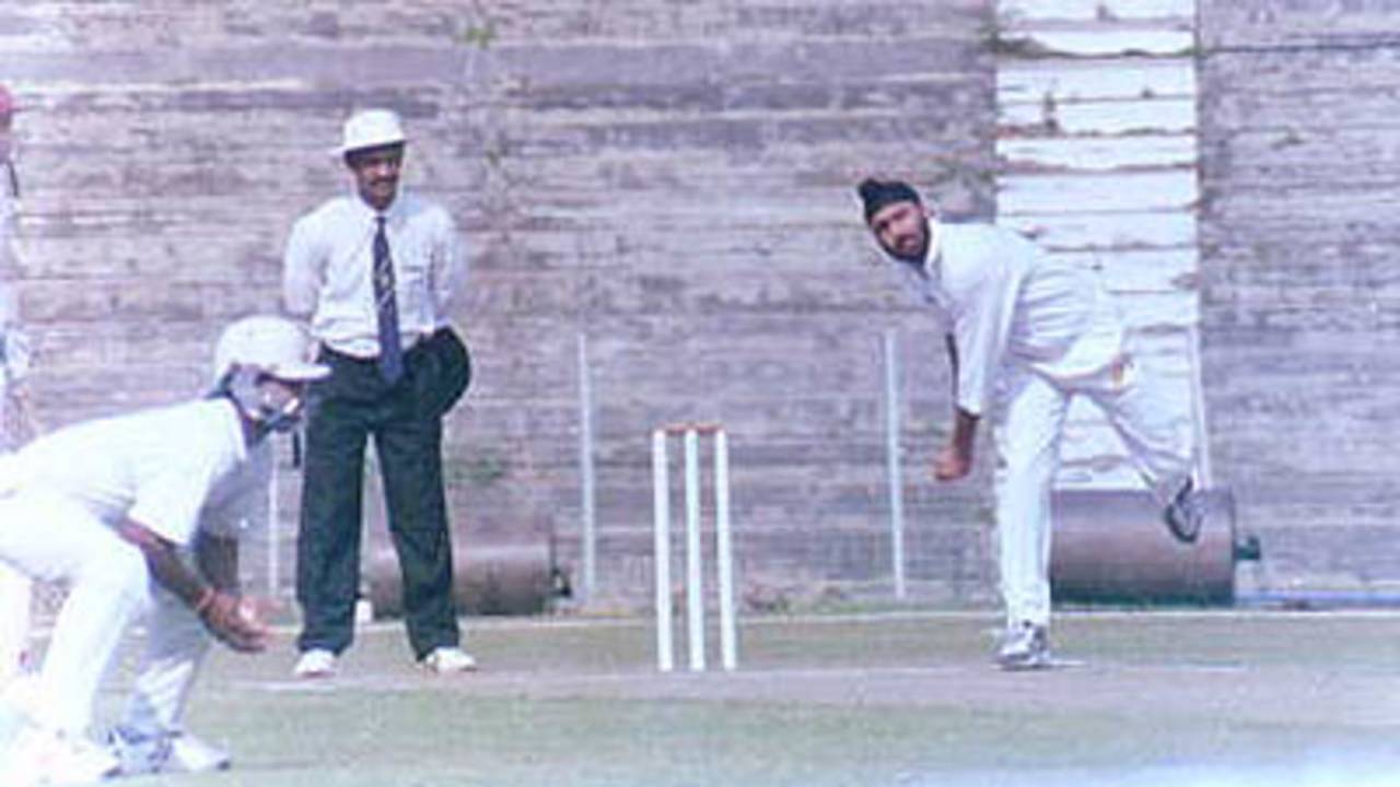 Sukhbinder Singh of Assam just about to deliver the ball