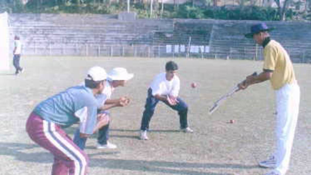 Sourav Dasgupta practises with his players. Ranji Trophy East Zone League, 2000/01, Tripura v Assam, Maharaja Bir Bikram College Stadium, Agartala, 14-16 December 2000.