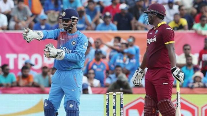 Happy with how we bowled in last eight overs - Dhoni