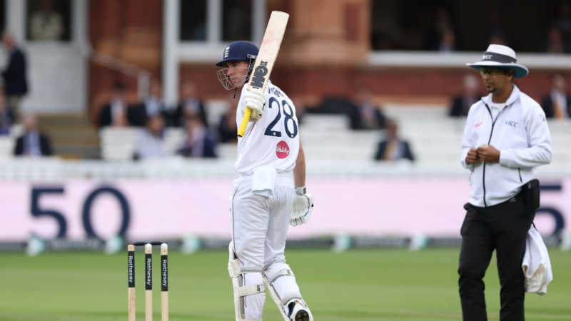 Dan Lawrence celebrates his fifty