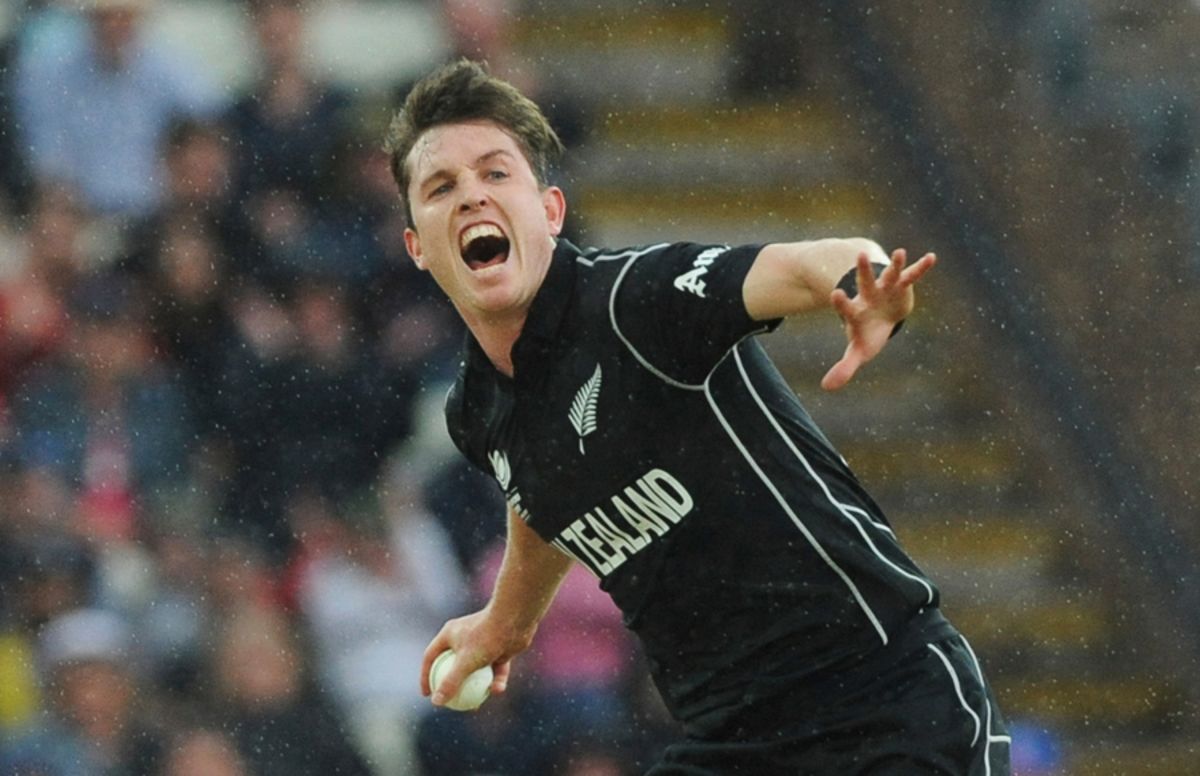 Adam Milne exults after snaffling a return catch to dismiss Moises Henriques even as rain came down heavy, Australia v New Zealand, Champions Trophy, Group A, Edgbaston, June 2, 2017