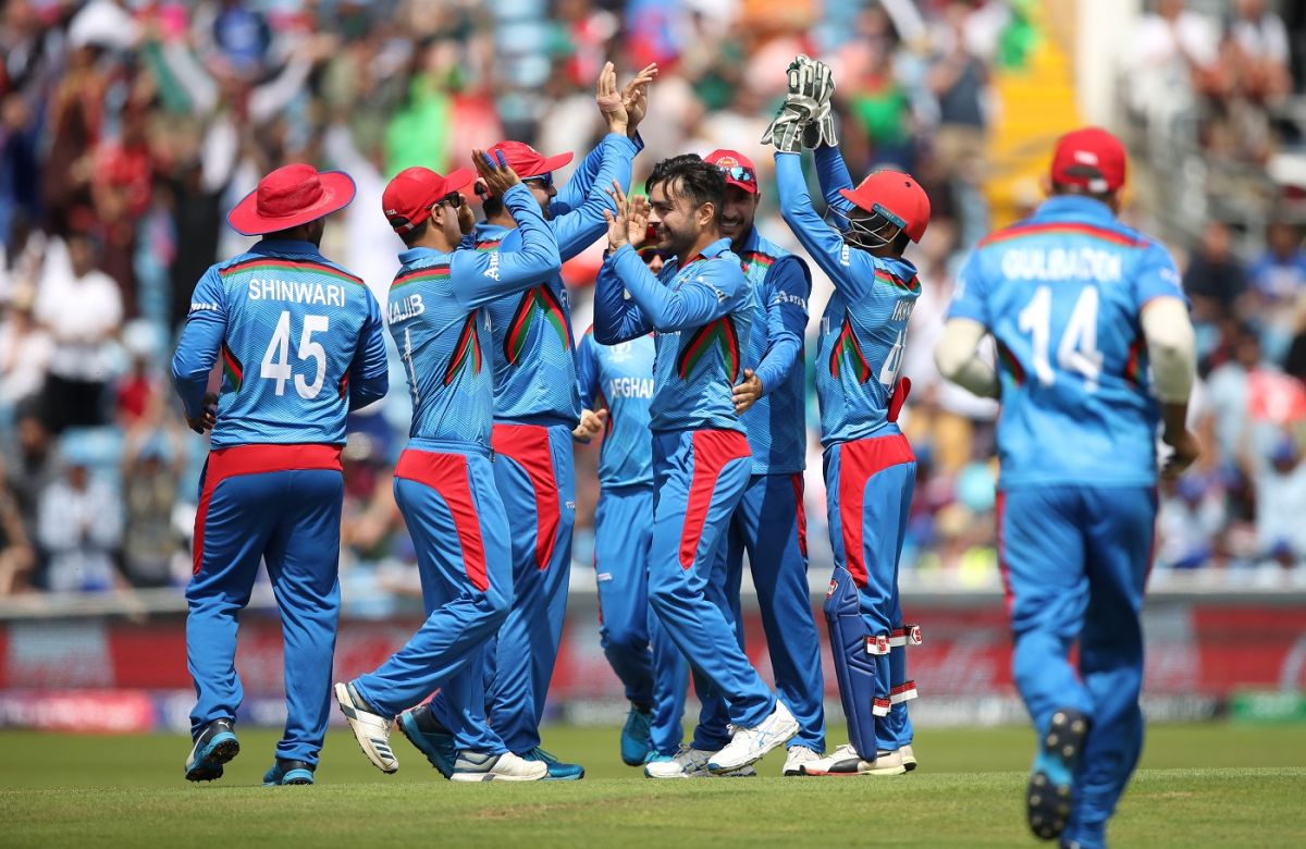 Rashid Khan celebrates dismissing Evin Lewis with his teammates, Afghanistan v West Indies. World Cup 2019, Headingley, July 4, 2019