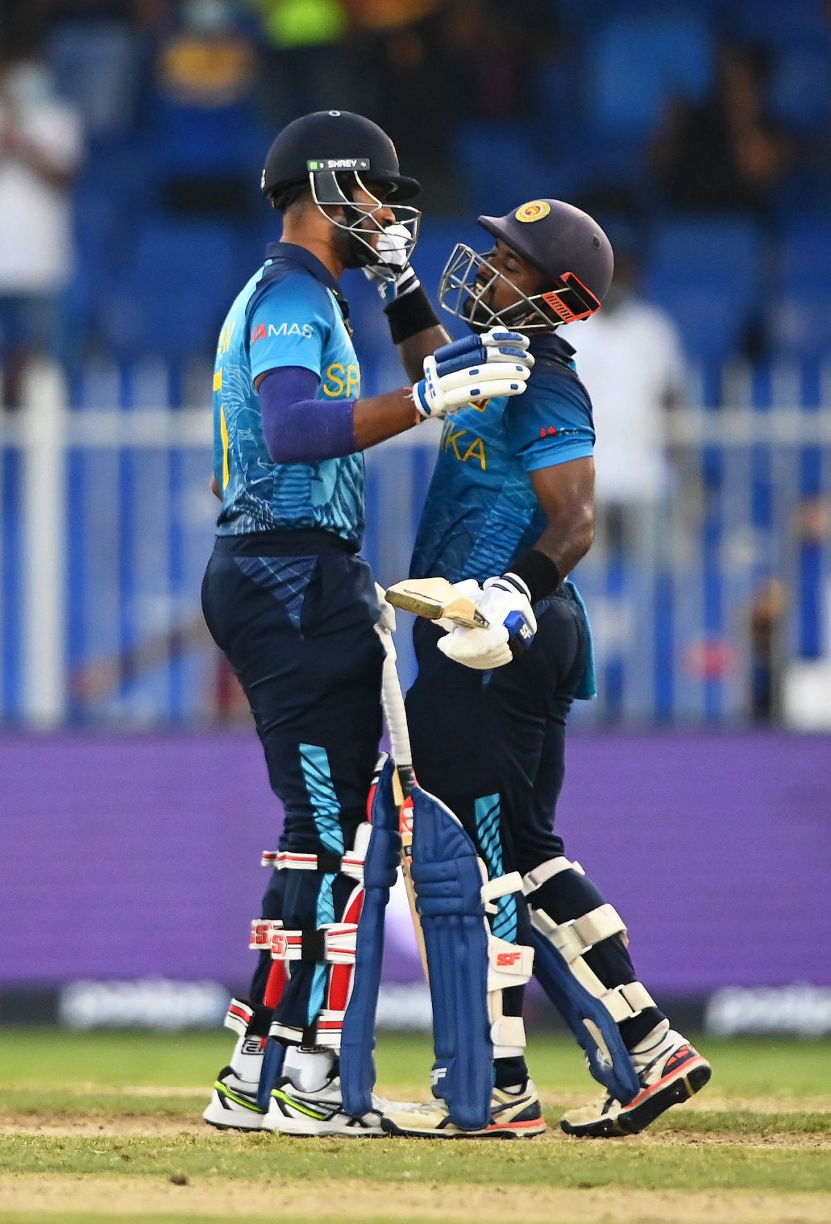 Dasun Shanaka congratulates Charith Asalanka after the win, Bangladesh vs Sri Lanka, T20 World Cup, Group 1, Sharjah, October 24, 2021