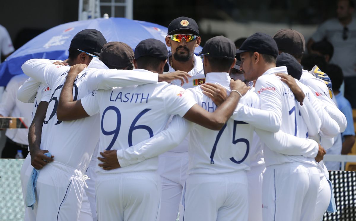 Suranga Lakmal, playing his final Test, looks on as the Sri Lankans huddle, India vs Sri Lanka, 2nd Test, Bengaluru, 1st day, March 12, 2022