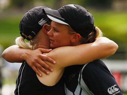 Suzie Bates embraces a teammate after scoring 168