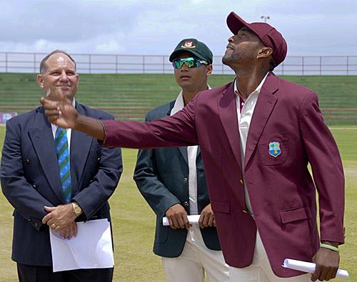 Newly appointed West Indies captain Floyd Reifer tosses the coin and