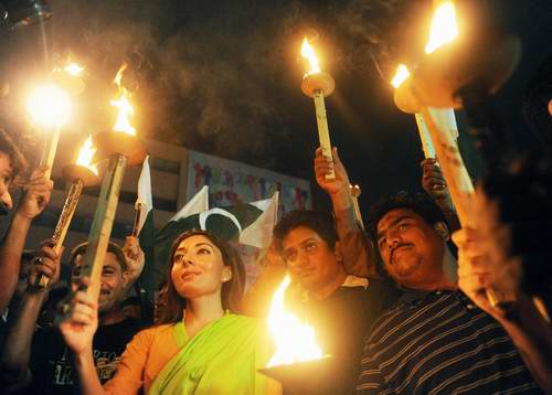 Pakistani Fans Hold Torches During A Rally To Celebrate The Team S Win