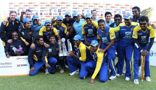 The victorious Sri Lankan team with the title | ESPNcricinfo.com