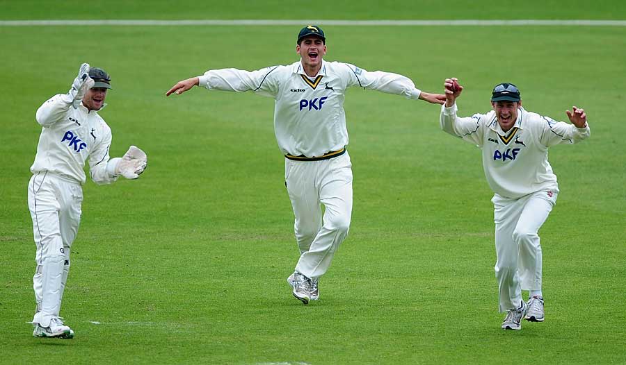Nottinghamshire's slip cordon celebrates the wicket of Jim Troughton