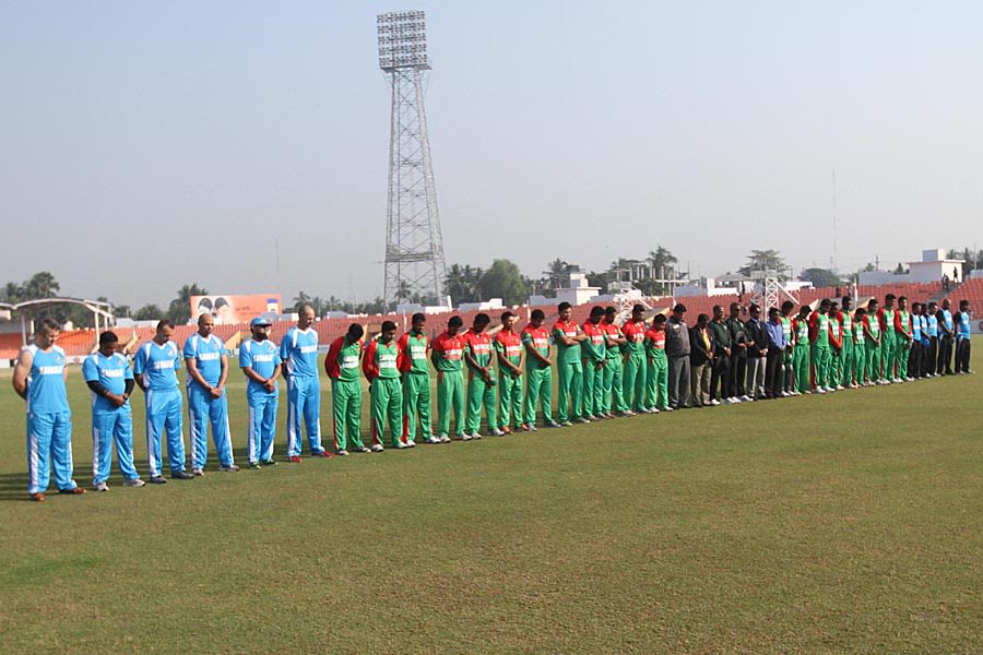 Players of Bangladesh and BCB XI line up for a minute's silence