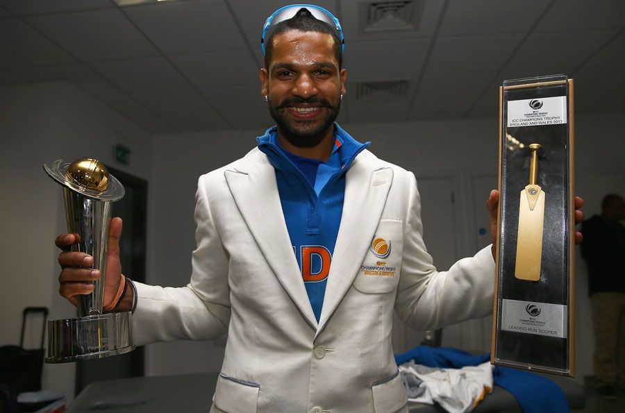 Shikhar Dhawan with his player of the tournament and golden bat awards