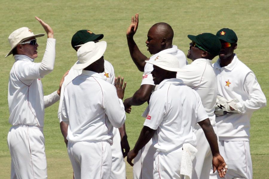 The Zimbabwe players celebrate a wicket | ESPNcricinfo.com