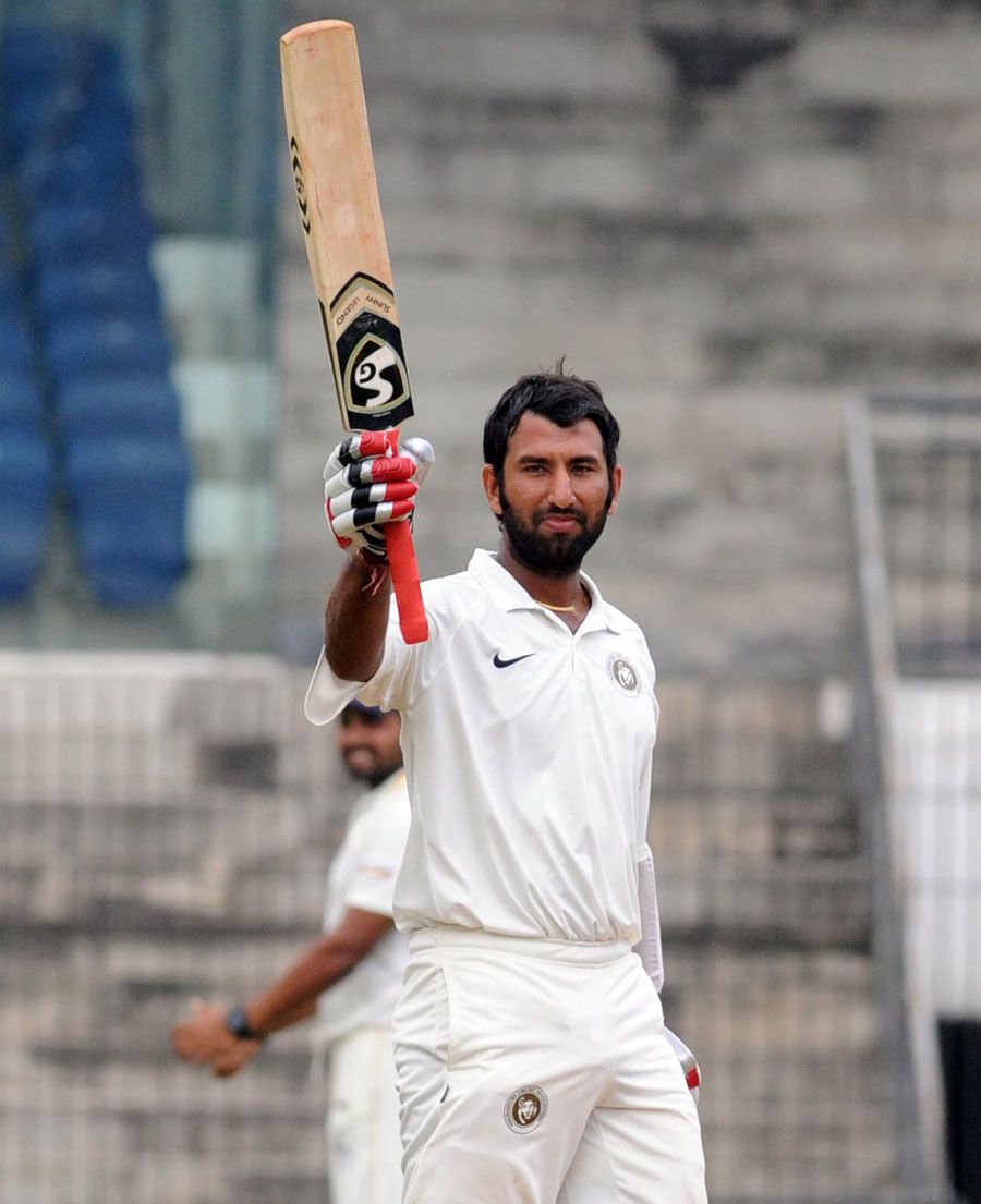 Cheteshwar Pujara acknowledges the crowd after reaching a double ...