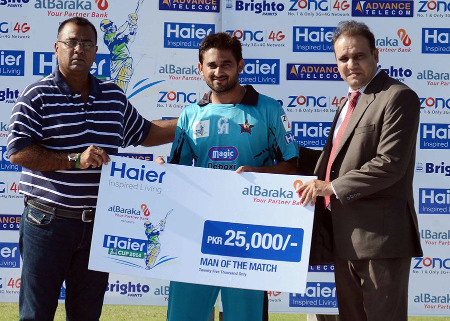 Awais Zia poses with his Man of the Match cheque