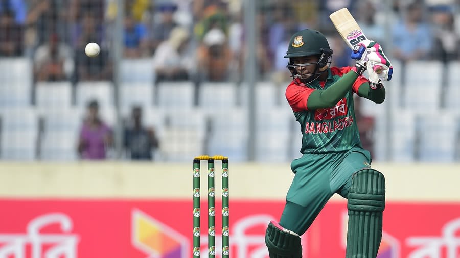 Man of the Match Mohammad Shahid and Shakib Al Hasan share a