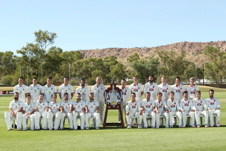 Victoria and South Australia pose with the Sheffield Shield