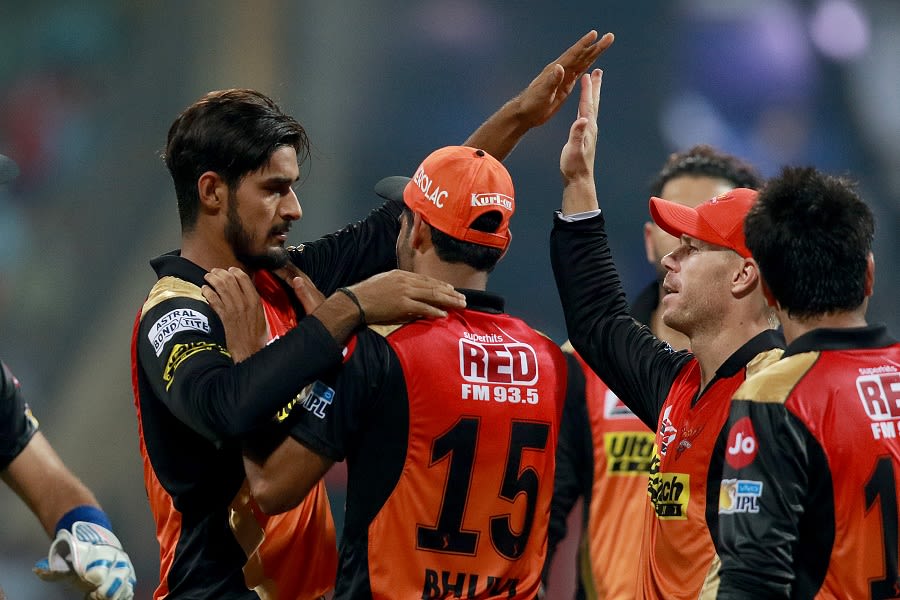 Deepak Hooda is congratulated by his team-mates after removing Parthiv ...