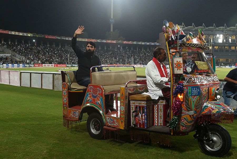 Former Pakistan captain Misbah-ul-Haq rides on an auto-rickshaw as he ...
