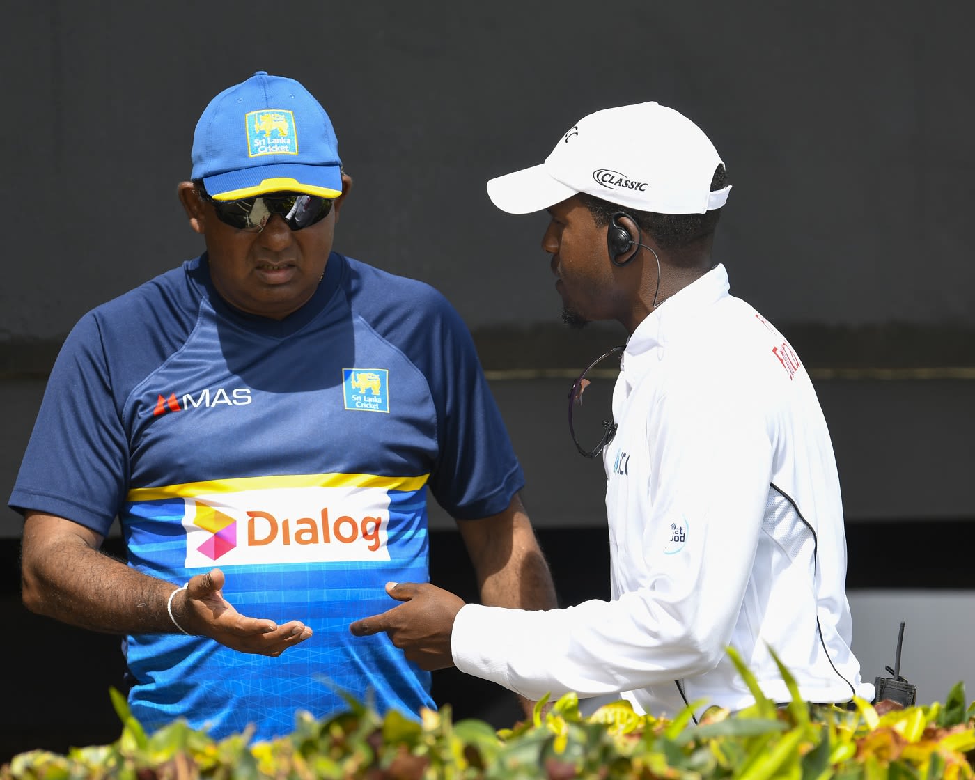 Sri Lanka team manager Asanka Gurusinha speaks with a match official ...