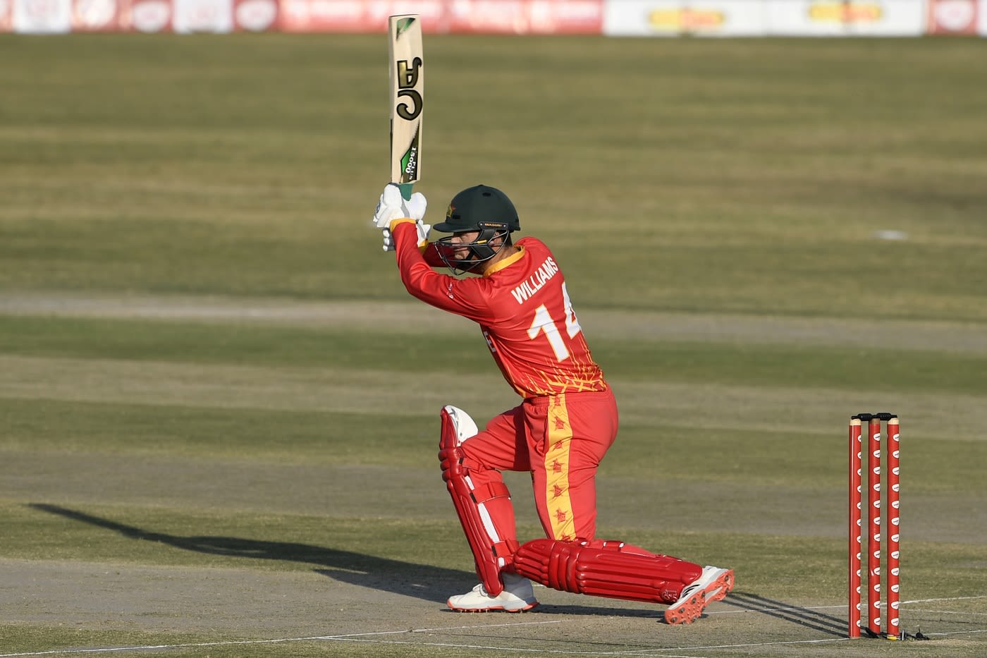 Sean Williams drives down the ground