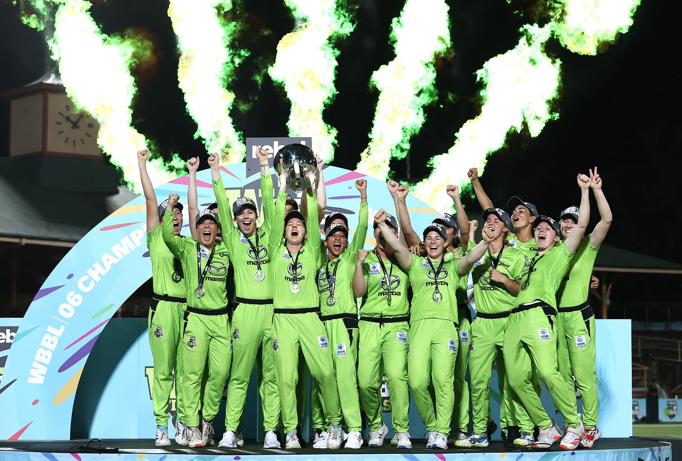 The Sydney Thunder players celebrate with the trophy