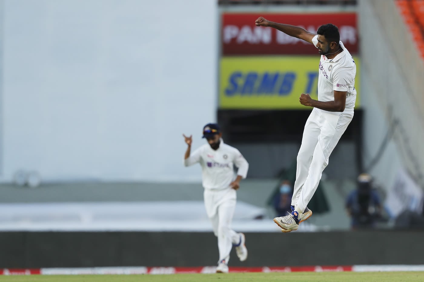 R Ashwin punches in the air after bowling Ollie Pope, his 399th Test
