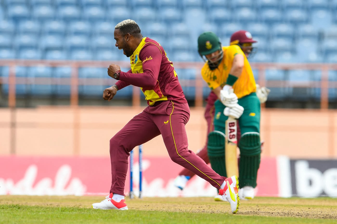 Fabian Allen celebrates a wicket