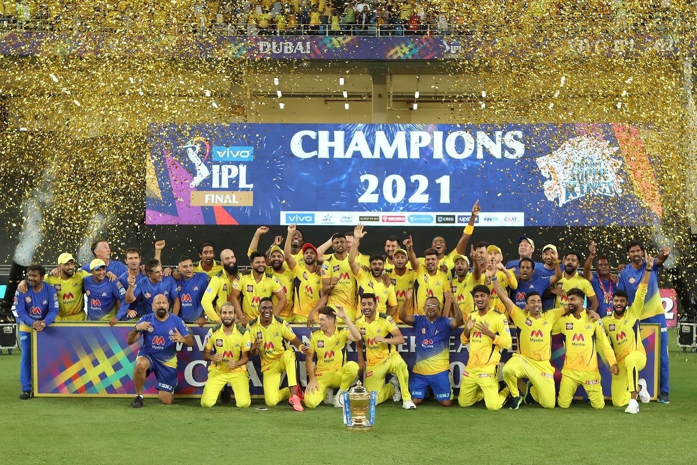 The Chennai Super Kings players pose with the IPL 2021 trophy ...