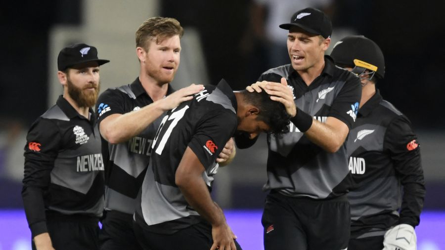 Ish Sodhi is mobbed by his team-mates after getting the wicket of Virat Kohli AFP/Getty Images