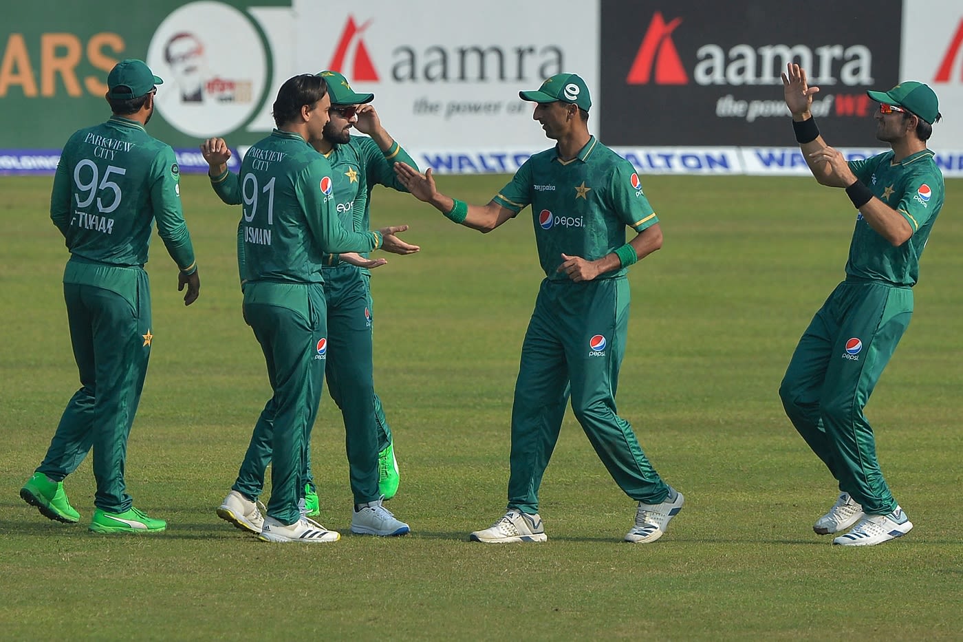 Usman Qadir celebrates with team-mates | ESPNcricinfo.com