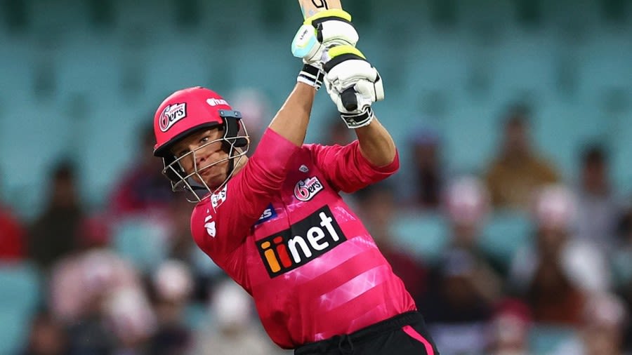 Josh Philippe lofts over mid on for Sydney Sixers