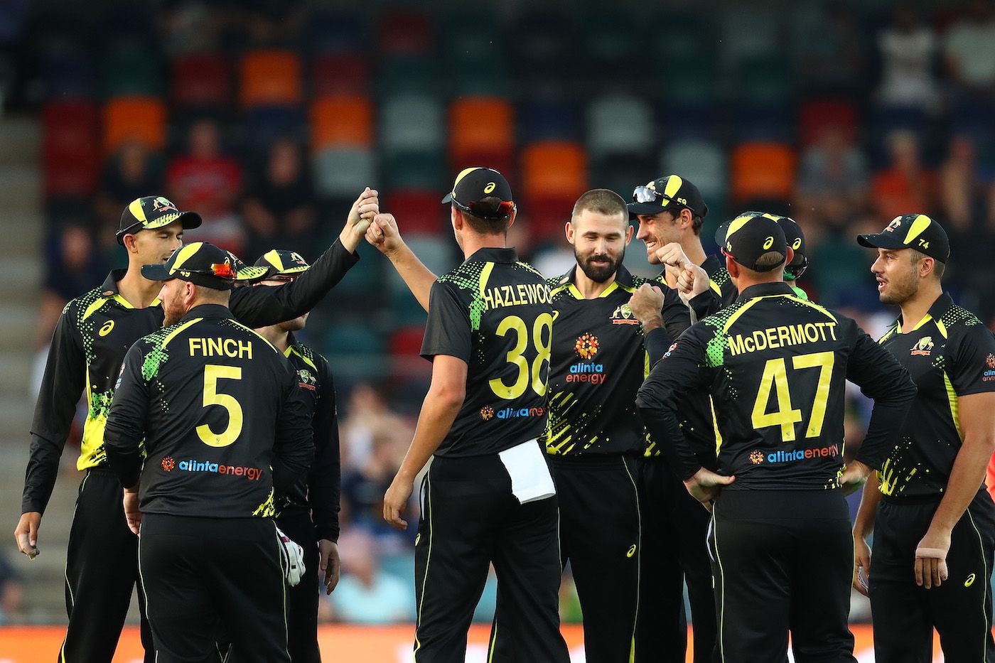 Kane Richardson celebrates with his team-mates after dismissing ...