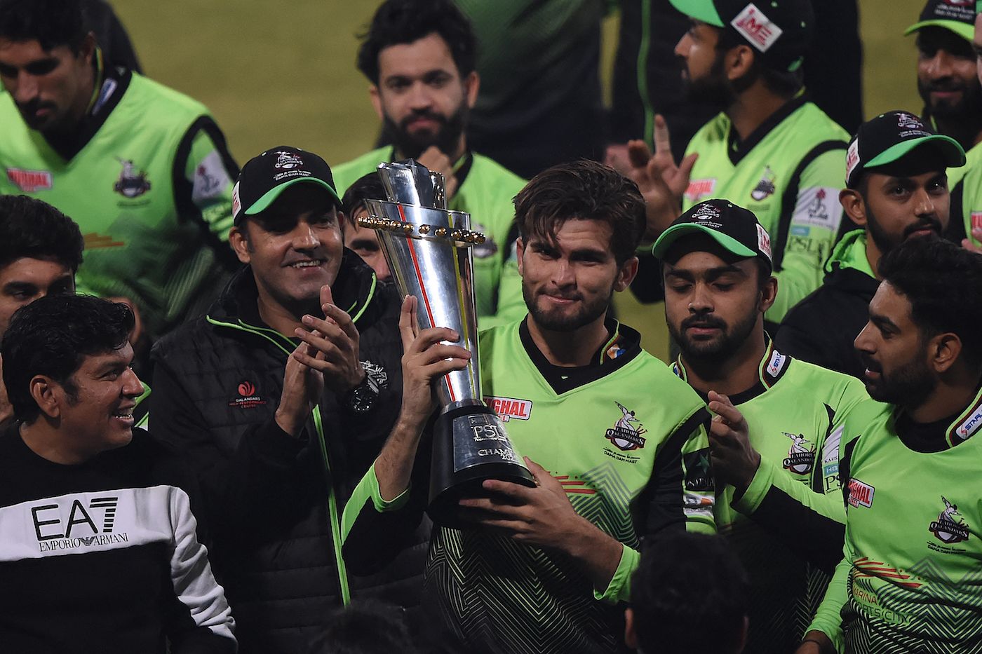 Shaheen Afridi holds up the trophy after leading Lahore Qalandars to