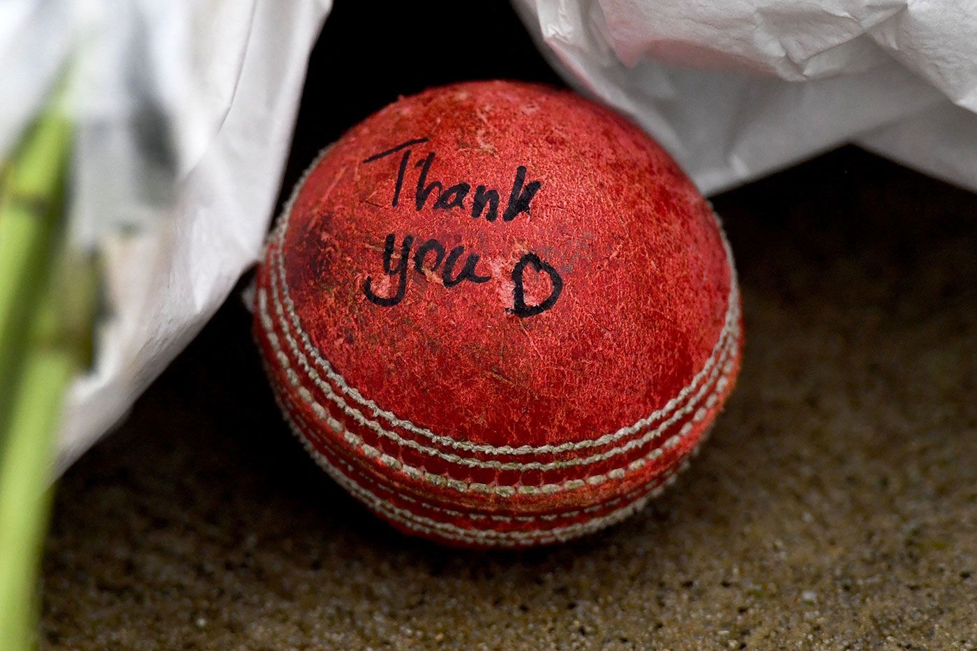 A signed cricket ball by Shane Warne's MCG statue