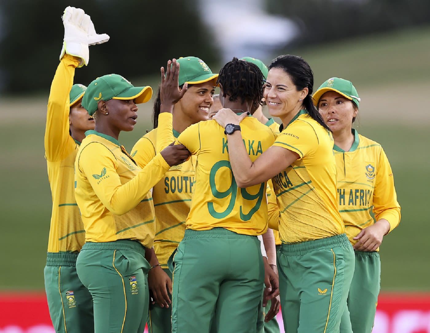 Ayabonga Khaka is encircled by her teammates after a wicket