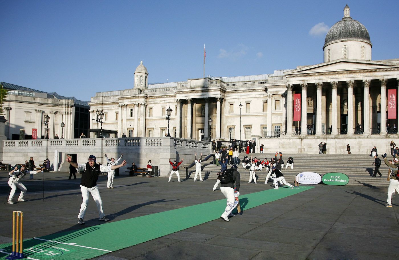 Charity cricketers warm up for a match on Mount Everest by converting Trafalgar Square into a