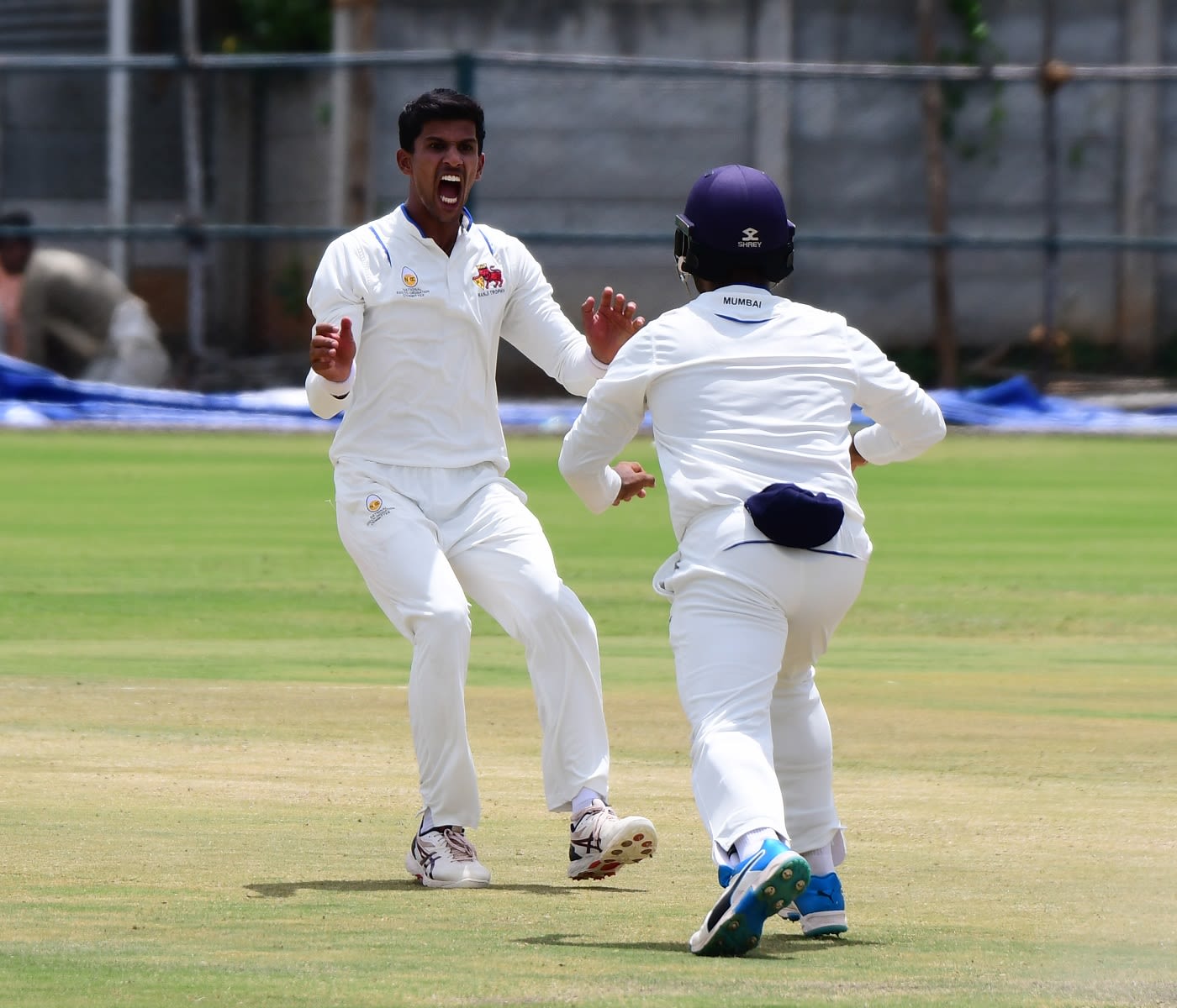 Tanush Kotian roars after taking a wicket ESPNcrici photo