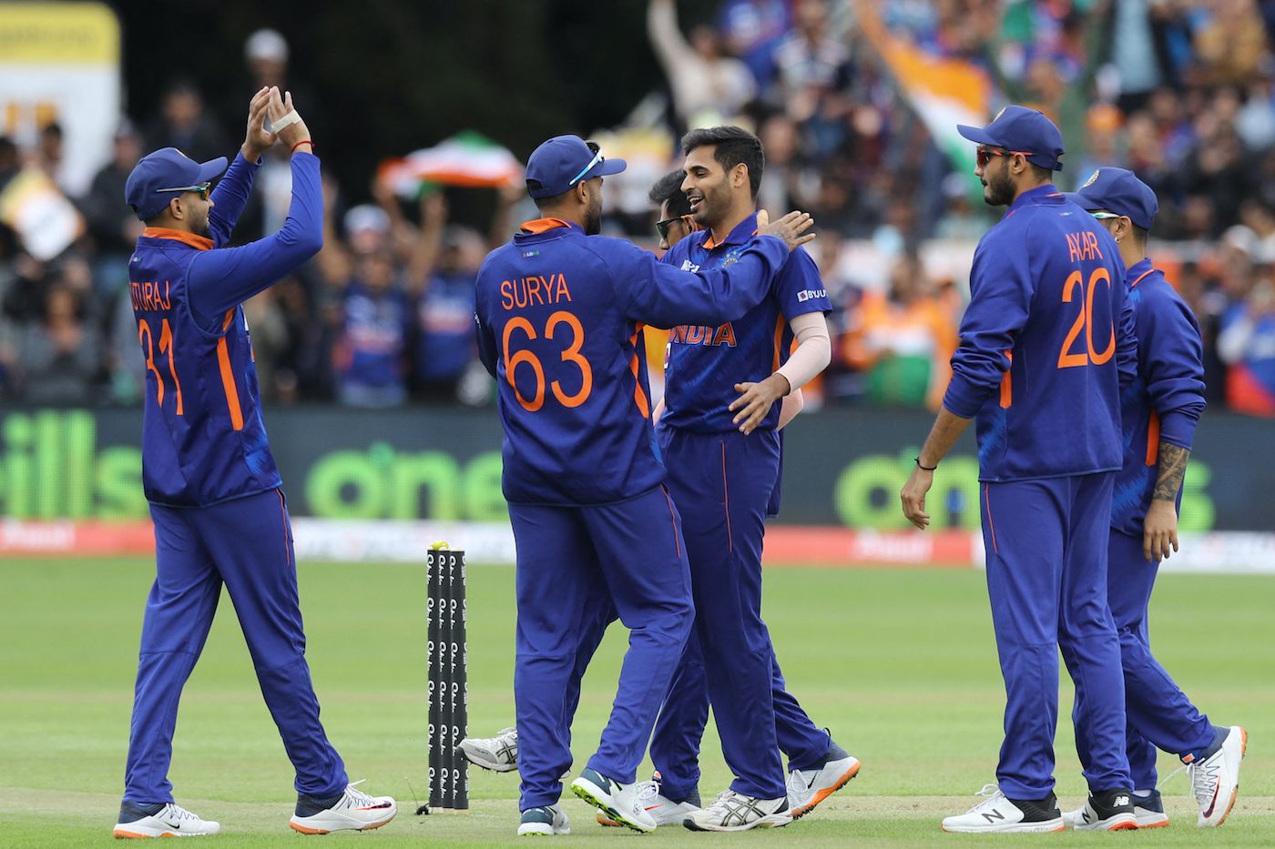 Bhuvneshwar Kumar celebrates a wicket with his team-mates ...